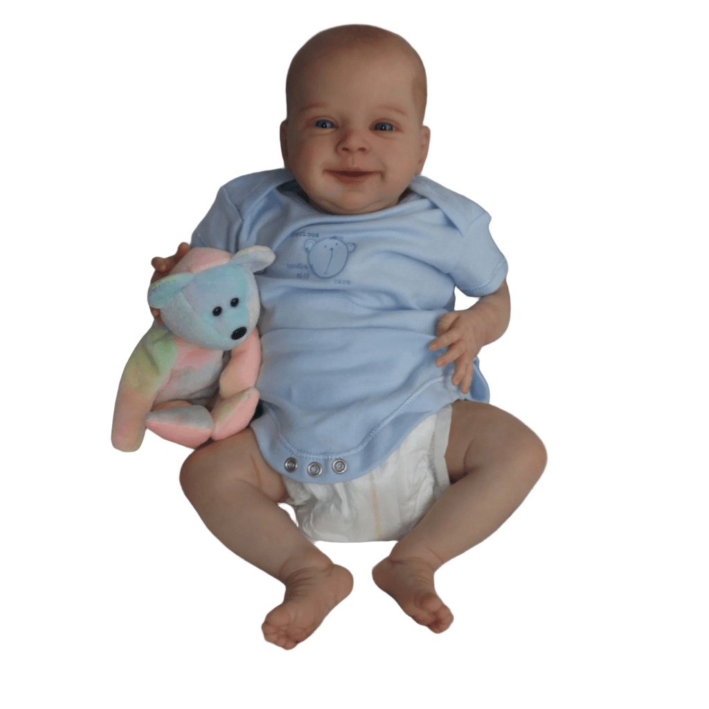 Baby in a blue onesie with a toy on a white blanket